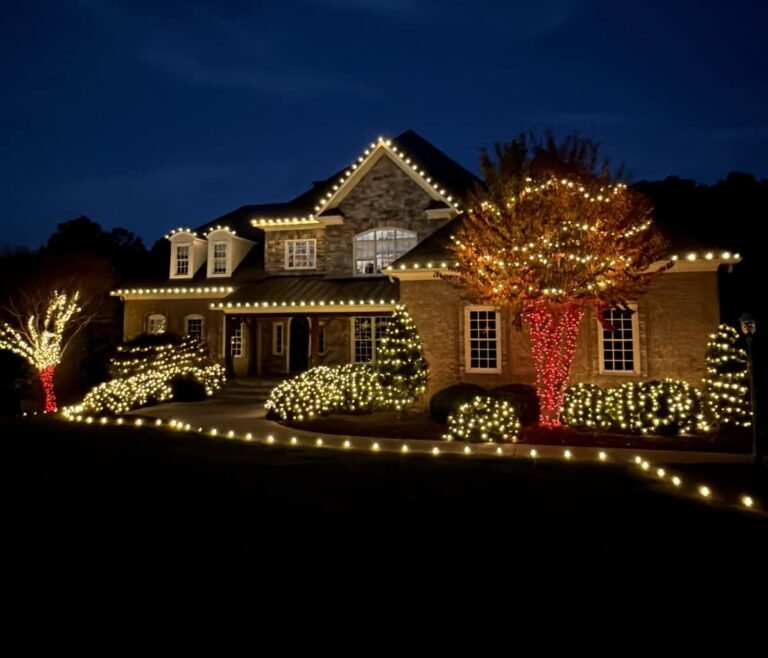 suburban residential home beautifully decorated for the holiday season by alpha holiday lighting and exterior solutions
