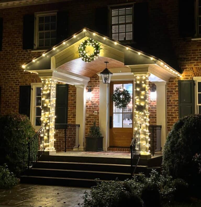 Residential entryway decorated by alpha holiday lighting