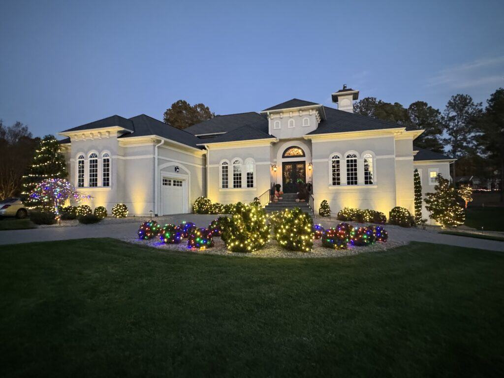 Residential home with christmas light landscape display installed and maintained by alpha exterior solutions in bon air VA