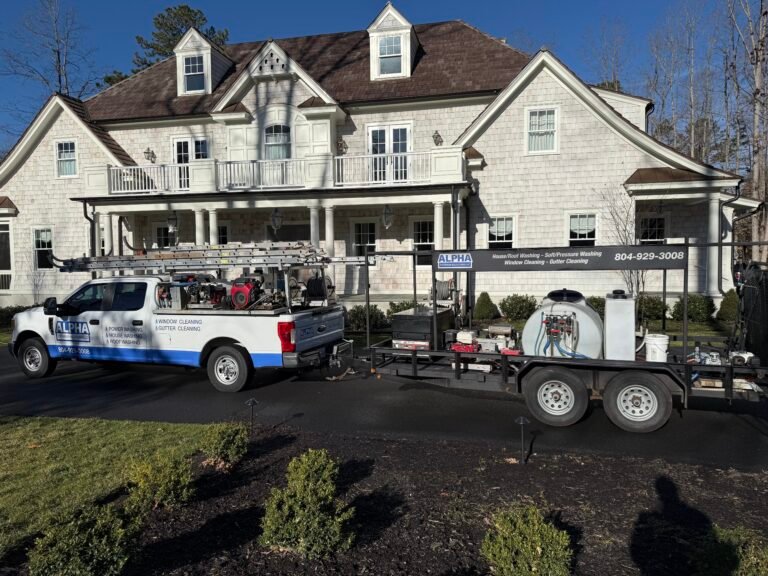 alpha exterior solutions company vehicle and trailer in front of residential home