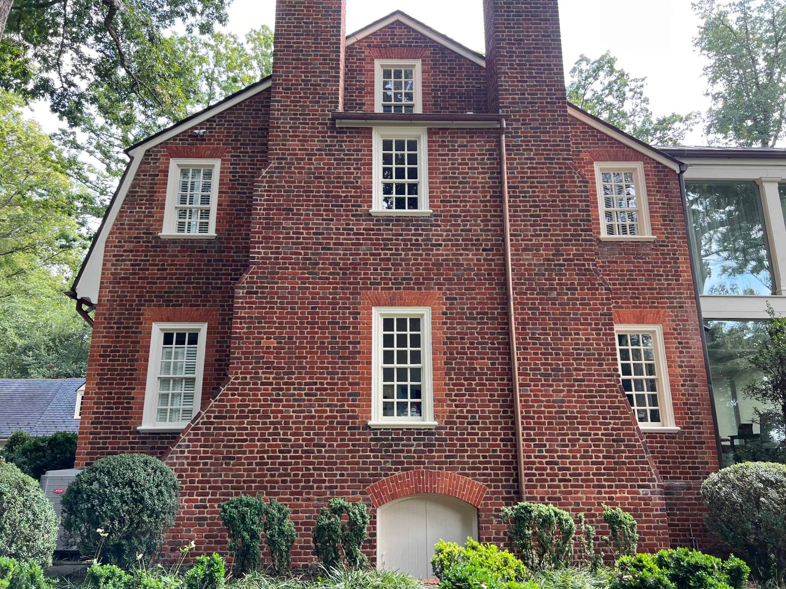 Large residential home after professional soft washing by alpha exterior solutions