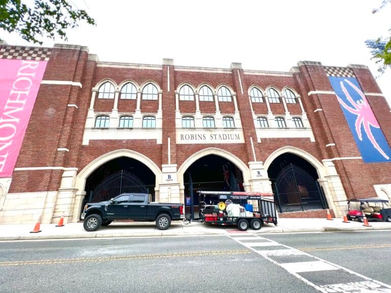 Alpha exterior solutions performing commercial exterior cleaning services for the university of VA at Robins Stadium