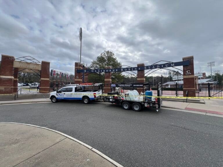 Alpha exterior solutions performing commercial exterior cleaning services for the university of VA at Robins Stadium