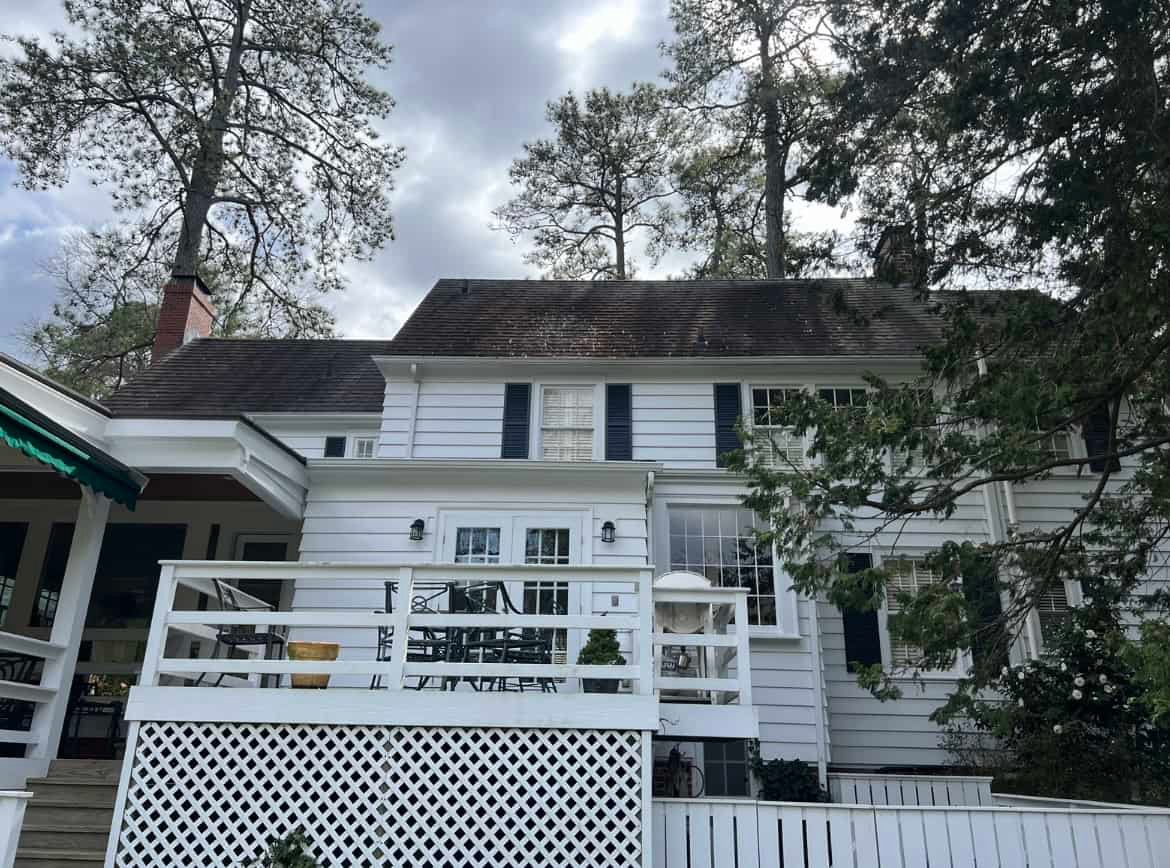 Residential home with asphalt shingle roof before roof cleaning and soft washing by alpha exterior solutions in Chesterfield virginia