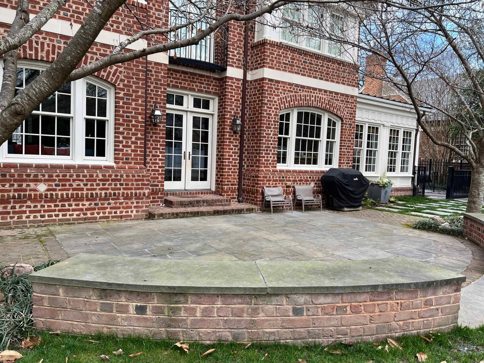 residential patio covered in buildup before professional cleaning by alpha exterior solutions