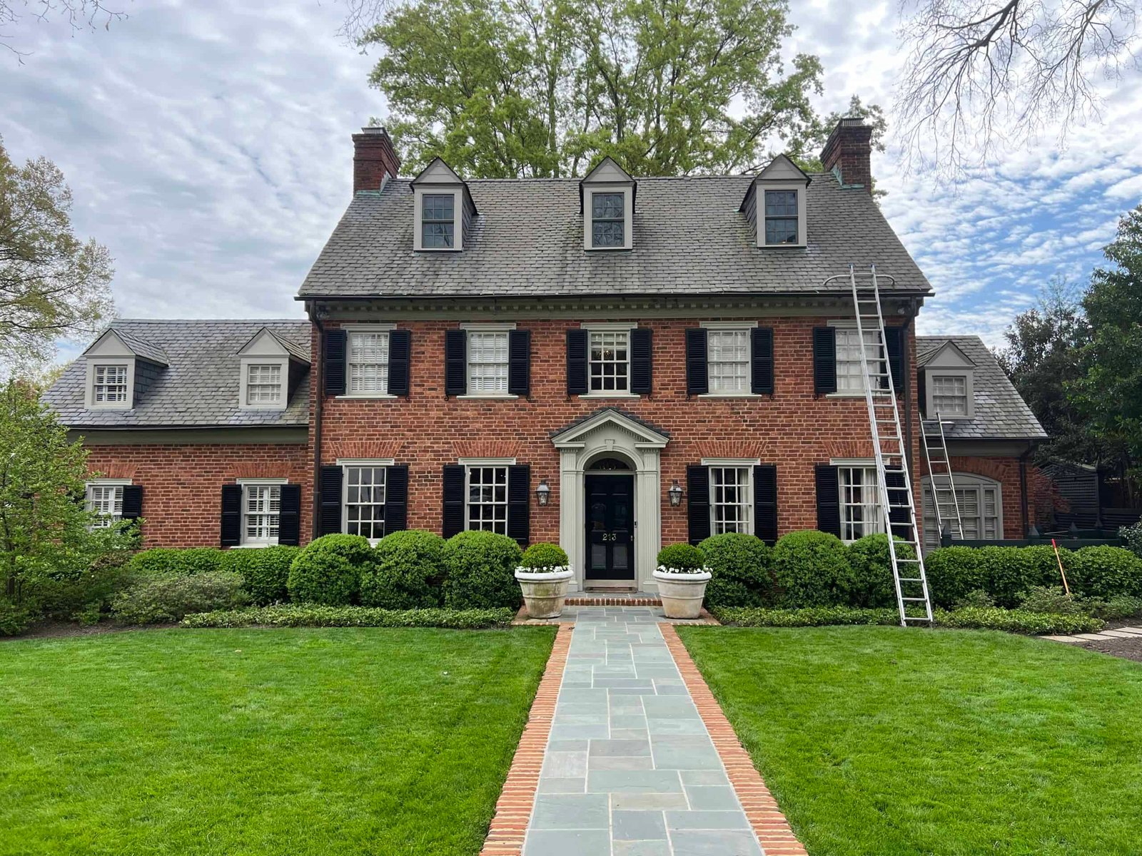 beautiful brick home with cedar roof before roof soft washing and exterior cleaning by alpha exterior services in henrico, va
