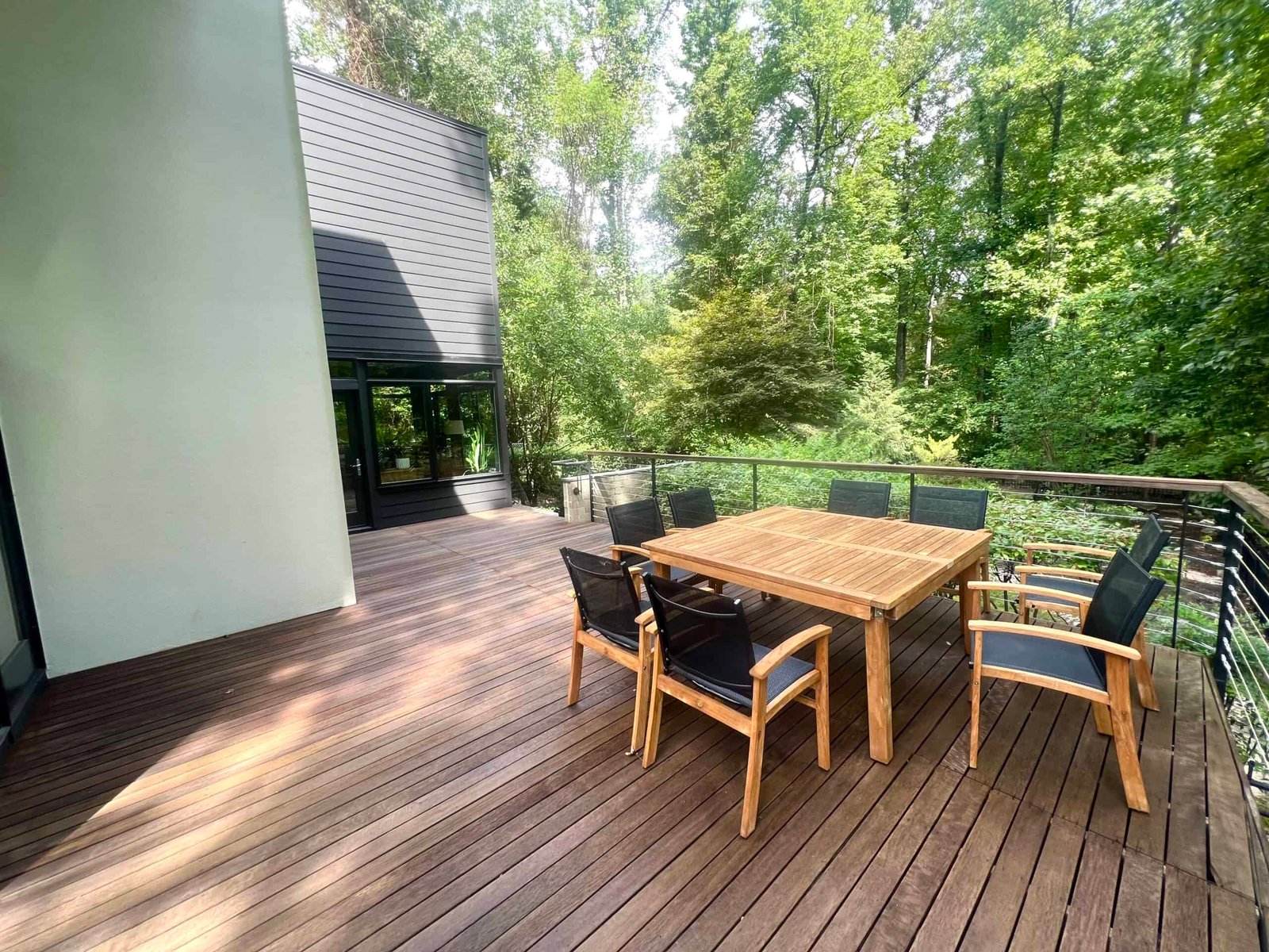 wooden deck and wooden patio furniture brought back to life by soft washing and deck staining by alpha exterior solutions in short pump va