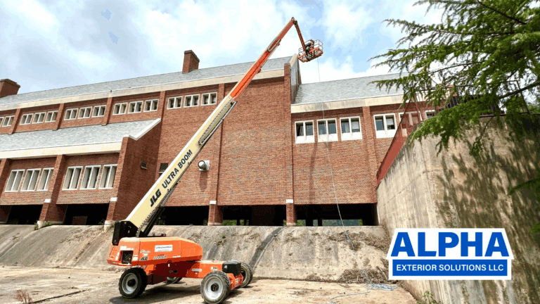 Alpha exterior solutions preforming commercial building washing and roof cleaning in cherry picker near powhatan va