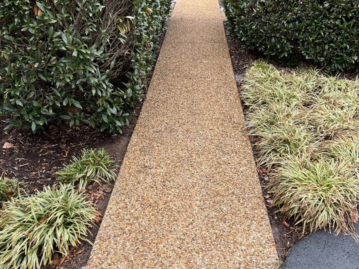 Pebble stone walkway newly cleaned and pressure washed by alpha exterior solutions in short pump virginia