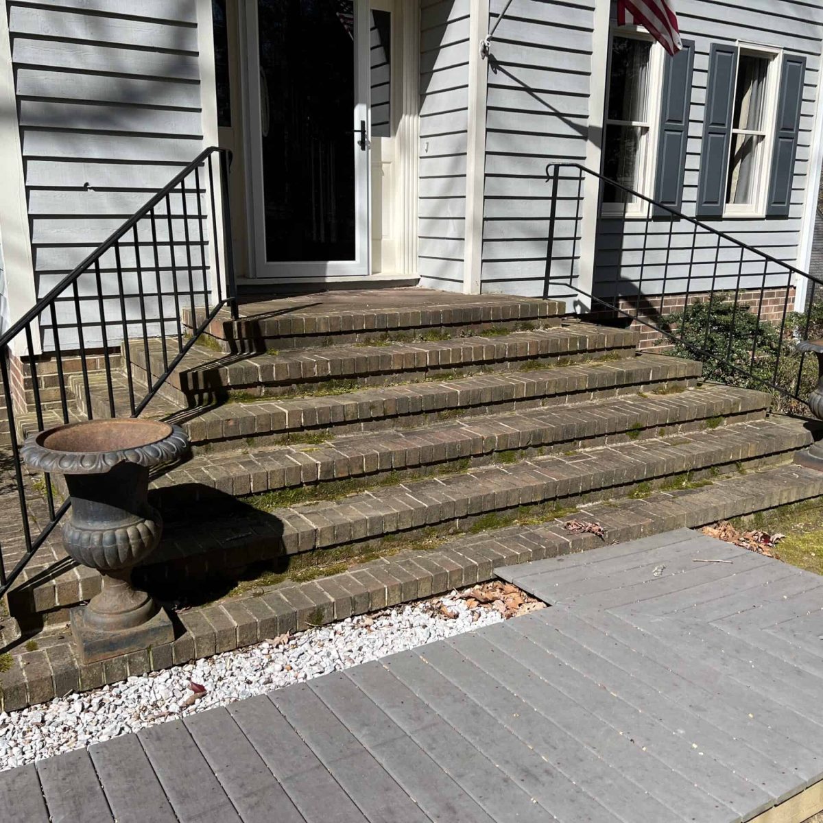 Before pressure washing of brick front steps and entry walkway at a Midlothian Virginia home