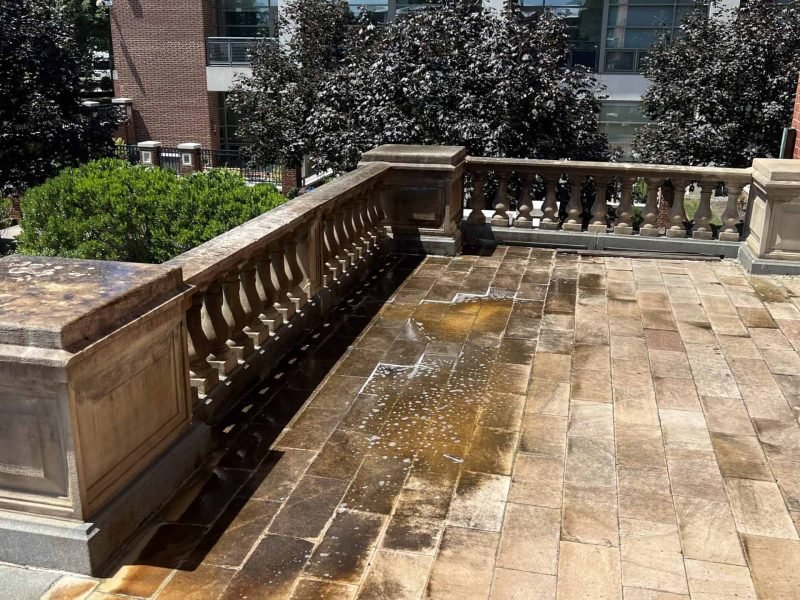 Commercial stone paver patio before being pressure washed by alpha exterior solutions in goochland VA