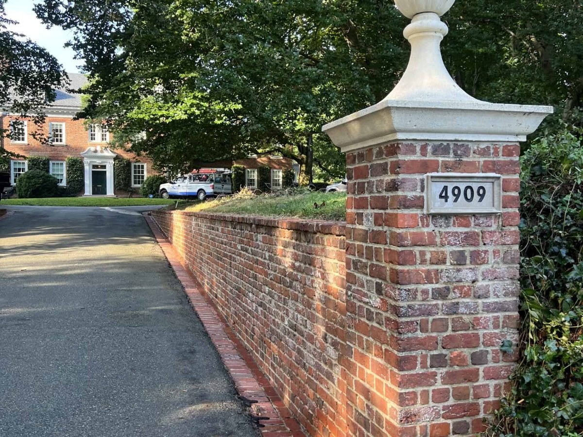 Residential brick driveway retaining wall after professional soft washing and cleaning by alpha exterior solutions near mechanicsville