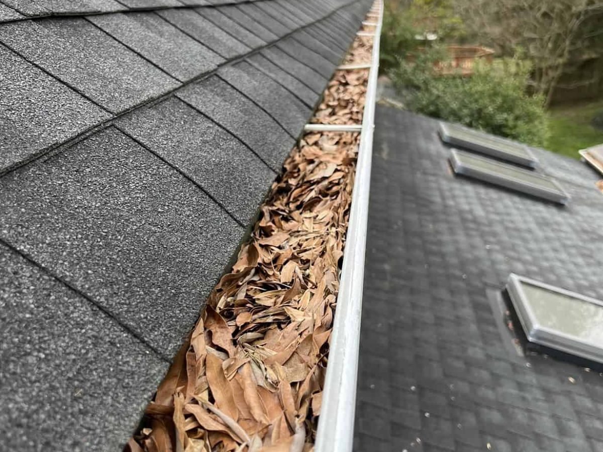 residential home with full gutters before gutter cleaning by alpha exterior solutions in richmond virginia