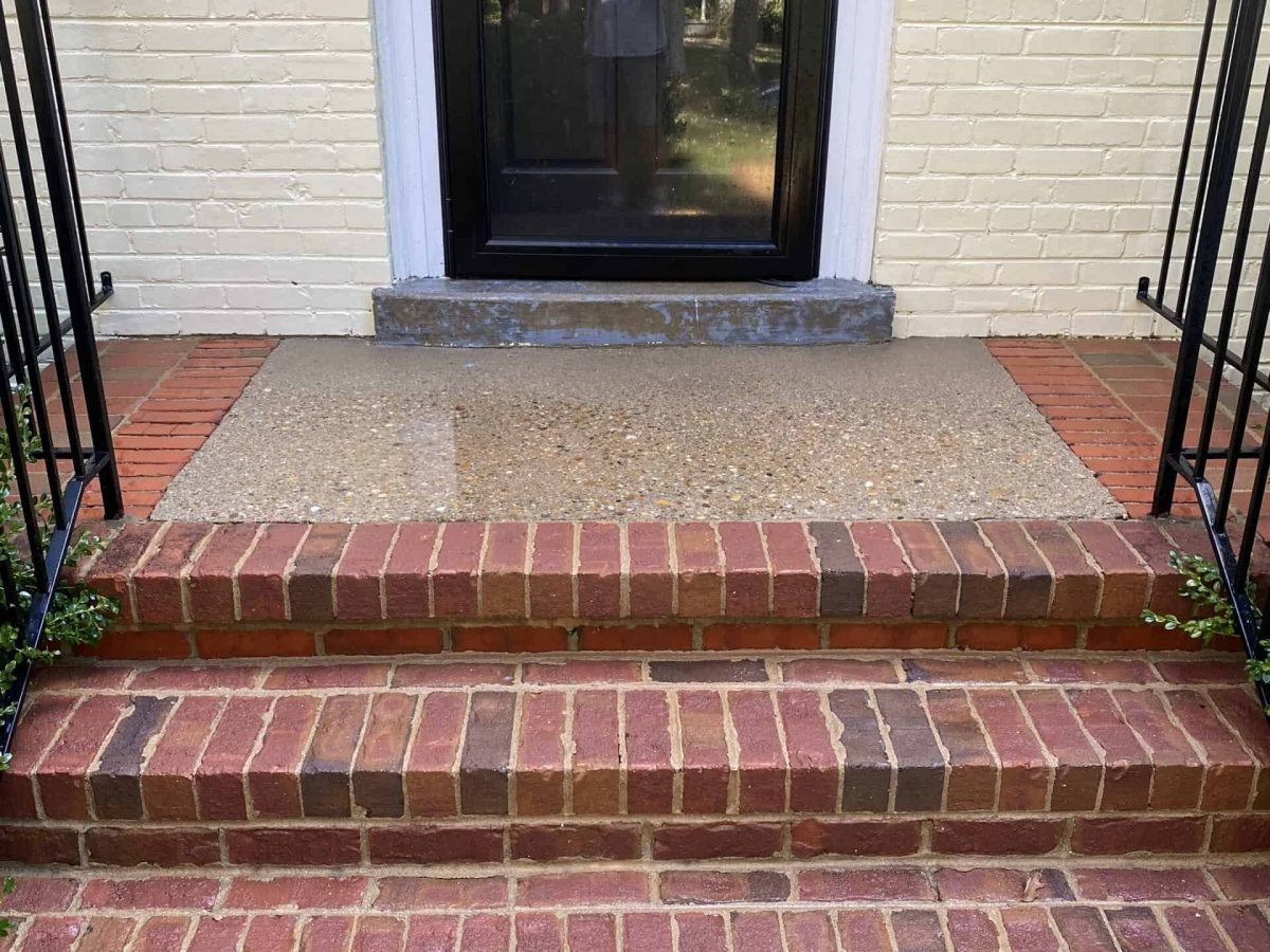 residential brick and pebble entry staircase after soft wash and sealing by alpha exterior services cleaning