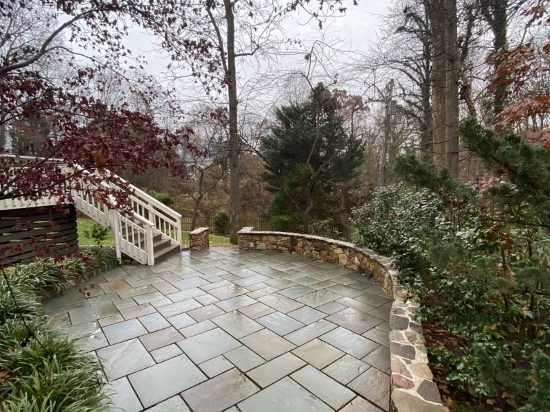 exterior paver patio and stone retaining wall after being power washed by alpha exterior cleaning