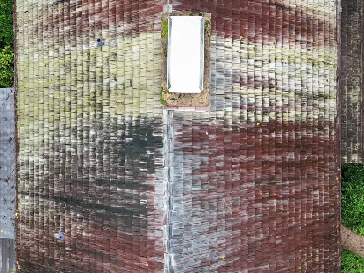 Drone view of residential home before cleaning by Alpha exterior solutions