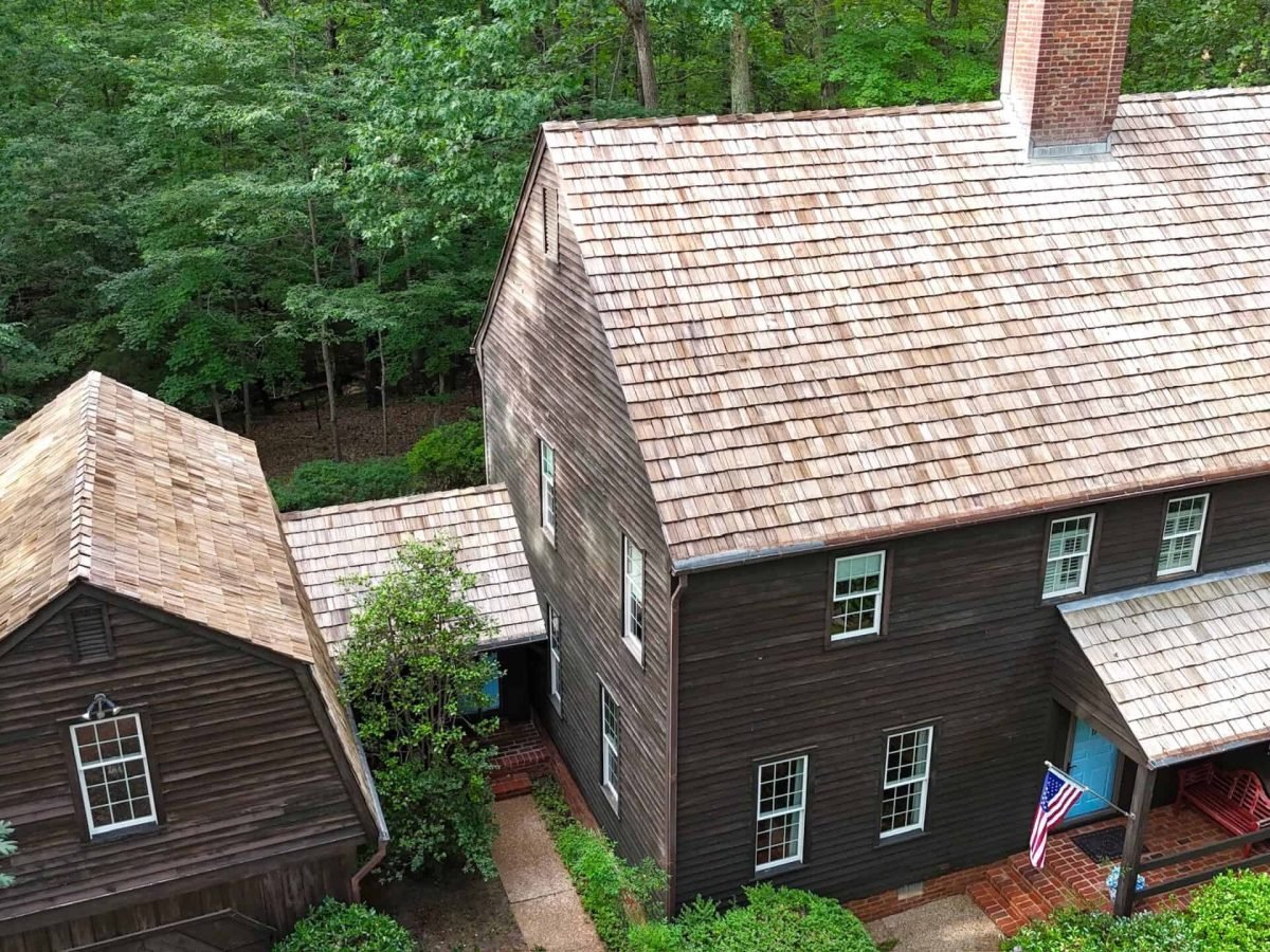 Drone view of residential home before cleaning by Alpha exterior solutions in white stone VA